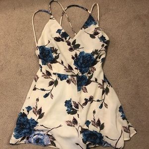 Floral Lush strappy back romper. NWOT. Size Xs.